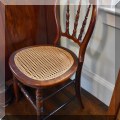 F61. Chair with caned seat. 